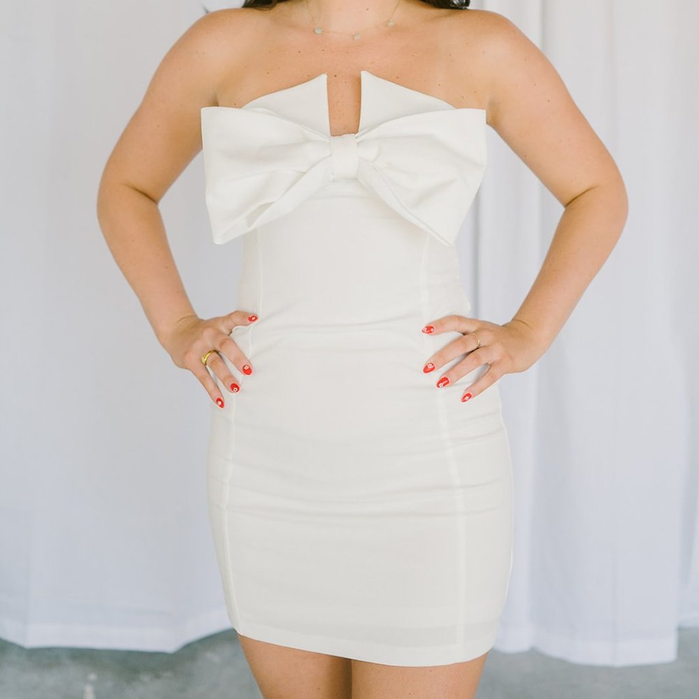 white strapless dress with large front bow